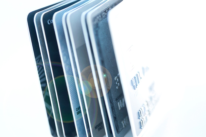 Close-up of a handful of credit cards.